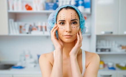 female patient with markers on her face cosmetician s office rejuvenation procedure in beautician salon cosmetic surgery against wrinkles preparation to botox b37262dd