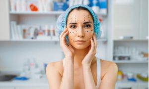 female patient with markers on her face cosmetician s office rejuvenation procedure in beautician salon cosmetic surgery against wrinkles preparation to botox c61ebec3